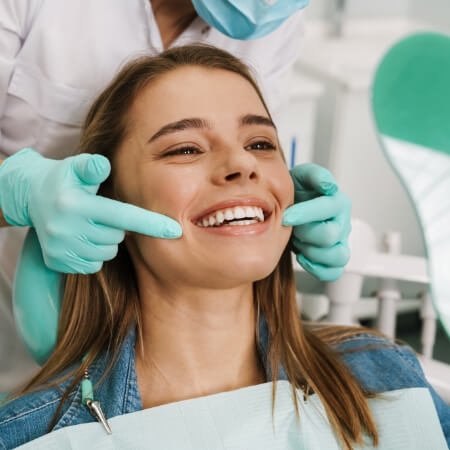 Woman smiling during dental exam