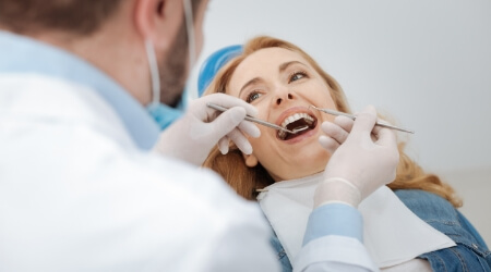 Dentist performing dental checkup