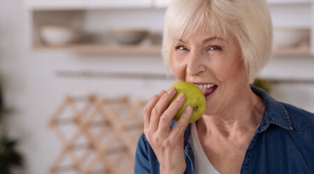 Woman eating an apple