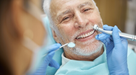 Man receiving a dental exam