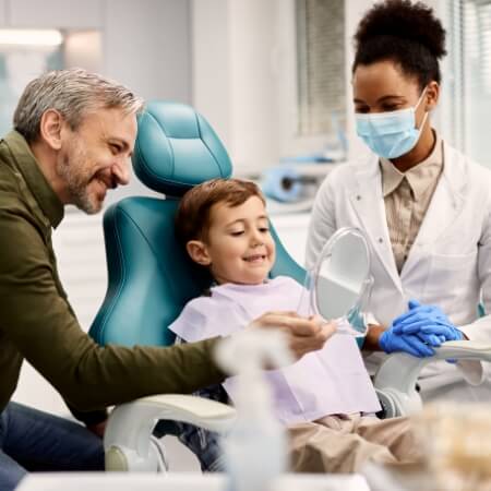 Child smiling during dental examination