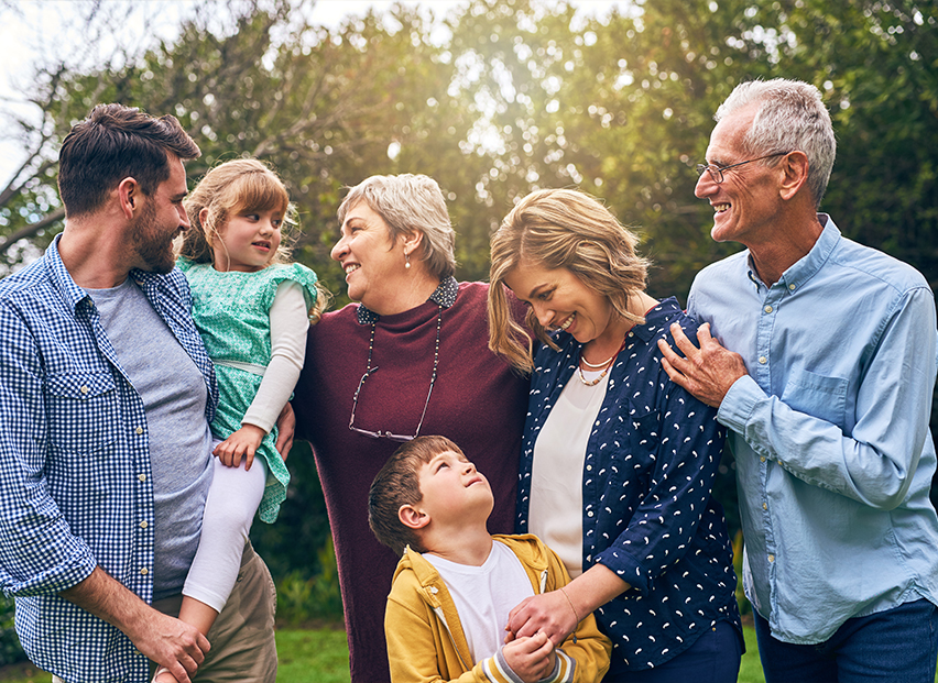 Three generations of family smiling together