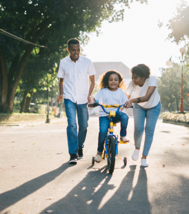 Family of three smiling together