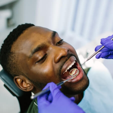 Dental patient receiving oral cancer screening