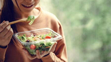 Person eating a salad